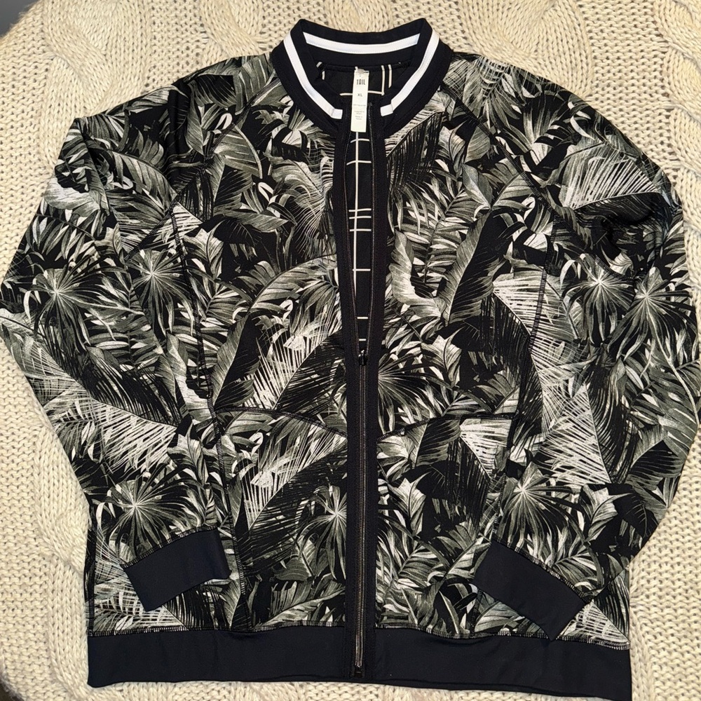 Tailgolf Reversible Jade Jacket featuring a tonal tropical print